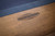 Engraved Made in USA logo detail on the Doc & Holliday Redford Slate Pool Table, built with custom American-made construction.