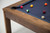 Doc & Holliday Redford Slate Pool Table in Van Dyk Brown, featuring a wooden frame and blue felt surface with billiard balls arranged for a game.