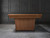 Doc & Holliday Kaci Slate Pool Table – Glazed Maple, pool table with a sleek wooden finish, set against a dark paneled wall.