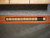 Doc & Holliday Paula Parsons Shuffleboard Table – Natural Walnut, close-up of the scoring track with numbered tiles.