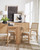 Hooker Furniture Retreat Rectangle Dining Table with 1-22 inch leaf, showcasing a modern wood dining table in a bright, minimalist room with decor, chairs, and artwork.