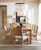 Hooker Furniture Retreat Cane Back Arm Chair, set of two dining chairs with cane backs and upholstered seats in a modern dining room.