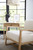 Hooker Furniture Retreat Pole Rattan Dune End Table, modern living room decor with natural wood end table and minimalist artwork.