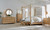 Hooker Furniture Retreat Camp Light Wood Stool Bed Bench, a wooden bed bench with a cushioned top and wooden frame, in a contemporary bedroom setting with neutral decor.