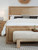 Hooker Furniture Retreat California King Cane Panel Bed, close-up of the bed with a natural wood finish and cane panel details on the headboard and footboard in a bedroom setting.
