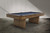 Doc & Holliday The Slater Slate Pool Table, modern wooden pool table with a slate top and sleek design, set in an industrial-style room.