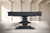 Plank & Hide Co Beaumont Slate Pool Table by Plank & Hide, black ash finish, modern design, sturdy wooden construction with a central pedestal base, in a minimalist room with light-colored walls and floor.