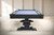 Plank & Hide Co Beaumont Slate Pool Table by Plank & Hide – Black Ash, showing a sleek black ash finished pool table with a blue felt surface in a modern, minimalist room.