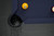 Plank & Hide Co Isaac Slate Pool Table in Black Ash, with a close-up of the corner showcasing the table's dark wood finish and billiard balls on the playing surface.
