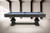 Side profile of the Beaumont pool table in Marble Grey, emphasizing the long clean apron, slate construction, and symmetrical double pedestal base.