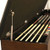 C.L. Bailey Skylar Storage Bench, open storage compartment with pool cues and billiard balls inside.