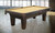 C.L. Bailey Duke Slate Pool Table, traditional design with dark wood finish and beige felt playing surface in a modern game room.
