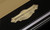C.L. Bailey Duke Slate Pool Table, close-up of the ornate gold and black metal plaque showcasing the brand name and origin.