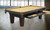 C.L. Bailey Duke Slate Pool Table, elegant dark wood billiards table with beige felt surface and built-in ball tray in a modern game room.
