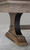 C.L. Bailey Viking Pool Table & Shuffleboard in Antique Oak, close-up of the wooden leg with black decorative metal accent and sturdy foot.