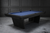 Full room lifestyle image of black ash Kaci pool table designed for modern home entertaining