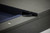 Doc & Holliday George Slate Pool Table in Marble Grey, close-up image showing the slate surface, dark wood frame, and electrical cord.
