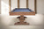 Plank & Hide Co Beaumont 8' Slate Pool Table, honey ash wood finish with blue felt playing surface in a neutral room setting.