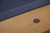 Plank & Hide Co Isaac 8' Slate Pool Table in Glazed Maple, detailed close-up of the wooden surface with a black hexagonal corner plate.