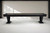 Doc & Holliday Savant Shuffleboard Table in Black Ash, modern outdoor shuffleboard table with sleek black ash finish and sturdy legs in a clean indoor setting.