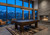 Doc & Holliday Maverick Rustic Slate Pool Table – Buffalo Nickel Rail Sights, in a modern game room with mountain view, large floor-to-ceiling windows, fireplace, and comfortable seating.