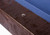 Doc & Holliday Maverick Rustic Slate Pool Table – Buffalo Nickel Rail Sights, close-up of corner with wooden frame and blue felt surface.