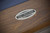 Doc & Holliday The Rook Slate Pool Table, close-up of the label on the wooden surface of the pool table.