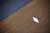 Doc & Holliday The Rook Slate Pool Table, close-up view of a corner of the wooden pool table with a white plastic corner protector.