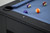 Doc & Holliday Peter Parsons Slate Pool Table in Matte Black Lacquer, close-up view showing the corner with playing balls on the blue felt surface.