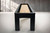 End view of the Peter Parsons custom shuffleboard table in Matte Black Lacquer finish.