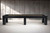 Doc & Holliday Peter Parsons Shuffleboard Table Matte Black Laquer, modern sleek shuffleboard table with black matte lacquer finish in a minimalist room.
