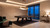 C.L. Bailey Mercer Slate Pool Table, modern indoor game room with stylish lighting and decor, large windows overlooking cityscape at night.