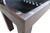 Plank & Hide Co Otis Bench with Storage, close-up of the corner showing wooden frame with metal safety caps on the edges.