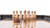 Plank & Hide Co Plank & Hide Shuffleboard Bowling Pin Set, wooden shuffleboard pins arranged on a game table with a puck in front, game equipment for shuffleboard and bowling.