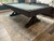 Plank & Hide Co Otis Slate Pool Table Smokehouse by Plank & Hide, dark wood-framed pool table with slate surface situated on a patterned rug in a game room or recreation area.