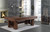 Playcraft BullRun 8' Slate Pool Table - | Rustic Timber Frame, a wooden pool table with a rustic timber frame design placed in a modern living room with large windows, a fireplace, and pool cues on a stand.