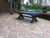 Sawyer Twain X-Air 8' Outdoor Slate Pool Table, outdoor backyard pool table on brick patio with scenic lake and trees in the background.
