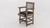 Plank & Hide Co Spectator Chair, wooden chair with armrests and black cushioned seat, designed with built-in storage drawer for convenience.