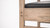 Plank & Hide Co Spectator Chair, close-up view showing the wooden frame and black cushioned seat.