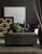 Hooker Furniture Leesburg Chairside Chest, dark wood textured storage table with intricate geometric pattern, placed in a modern living room setting with decorative items and artworks.