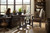 Hooker Furniture Mason End Table, a wooden end table with a dark finish and curved legs placed next to a leather sofa in a bright living room setting.