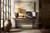 Hooker Furniture Bluewind Flip-Top Console Table, a rustic wooden console table with turned legs, positioned against a wall with decorative items and artwork, in a cozy home interior.
