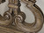 Hooker Furniture Melange Console Table, detailed close-up of its ornate, carved wooden design with a distressed finish.