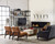 Hooker Furniture Studio 7H Scaffold Entertainment Console, modern living room with black leather sofa, brown chairs, and a large metal and wood entertainment unit with TV, decorative vases, books, and a fire feature.