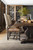 Hooker Furniture Bandera 86-inch Table with 2-18-inch Leaves, wooden dining table set in a modern dining room with beige upholstered chairs, wine and food on the table, and a wine rack in the background.