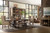 Hooker Furniture Bandera 86-inch Table with 2-18 inch Leaves, showing a spacious dining room with rustic wooden table, upholstered chairs, and large windows with mountain views.