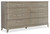 Hooker Furniture Affinity Host Chair, a stylish 8-drawer wooden dresser in a light, neutral color with textured finish and sleek metal handles.