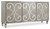 Hooker Furniture Sanctuary Buffet, elegant sideboard with decorative scrollwork design on cabinet doors and a distressed gray finish.