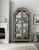 Hooker Furniture Alfresco Costa Display Cabinet, rustic wood and glass display cabinet with curved arched top and multiple shelves for storing and showcasing decorative items and dishware.