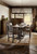 Hooker Furniture Comfort Counter Stool, rustic wooden counter stool with upholstered seat and backrest in a cozy dining room.